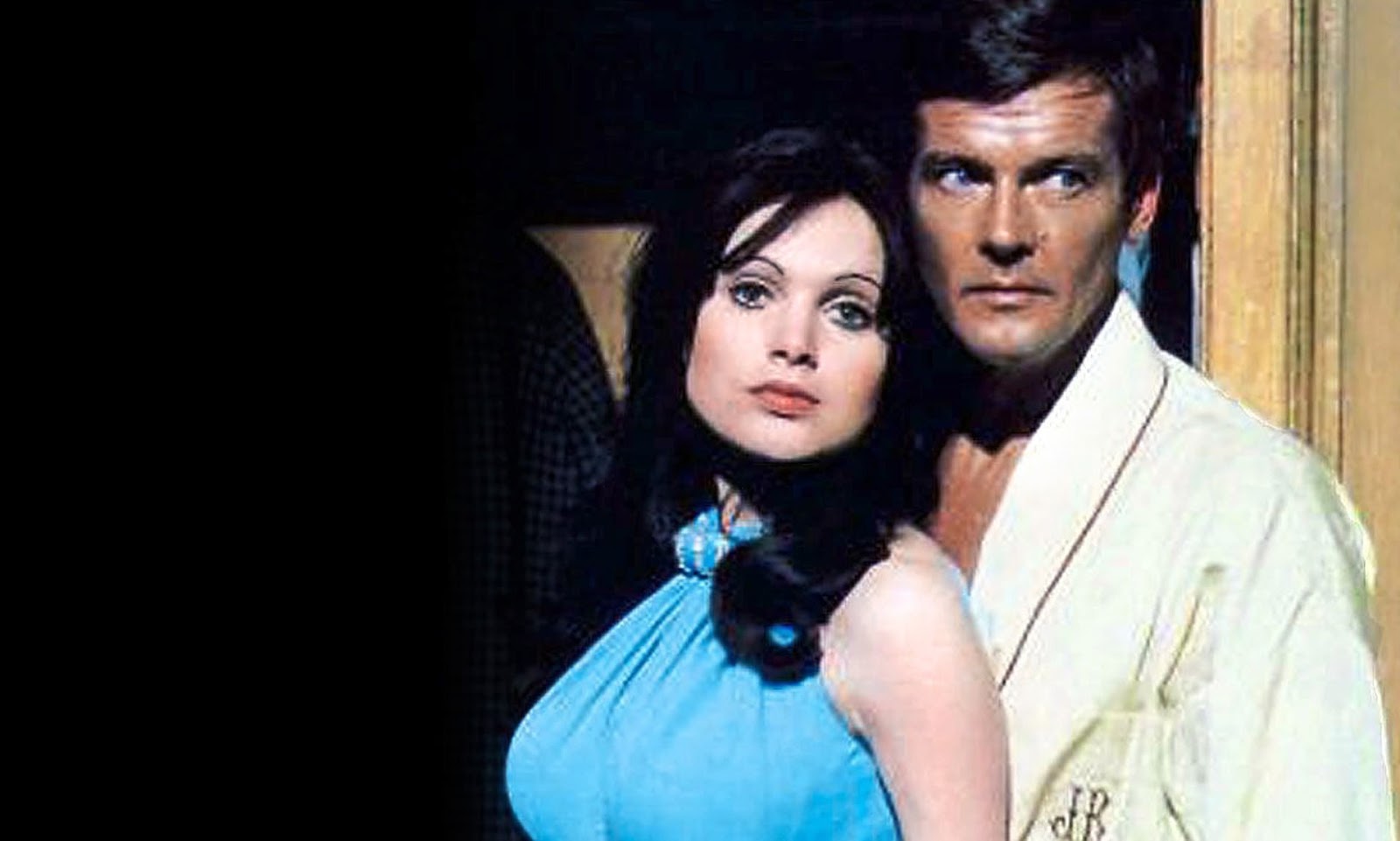 Actress Madeline Smith and Roger Moore as James Bond