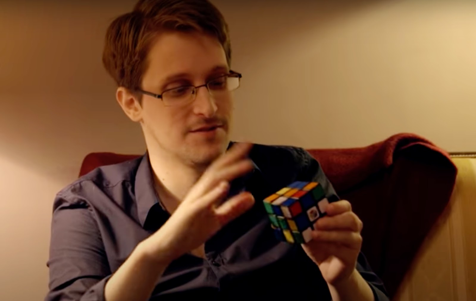 Edward Snowden with a Rubik's cube that he may have used to smuggle out NSA secrets