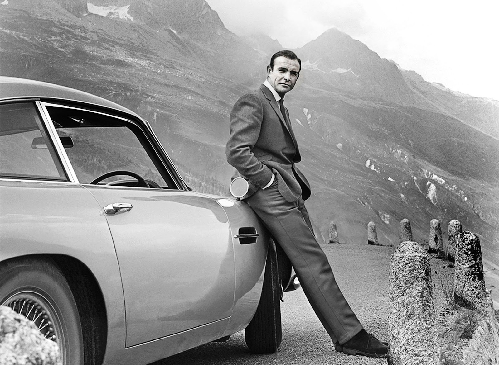 Sean Connery in Goldfinger next to his Silver Birch Aston Martin DB5