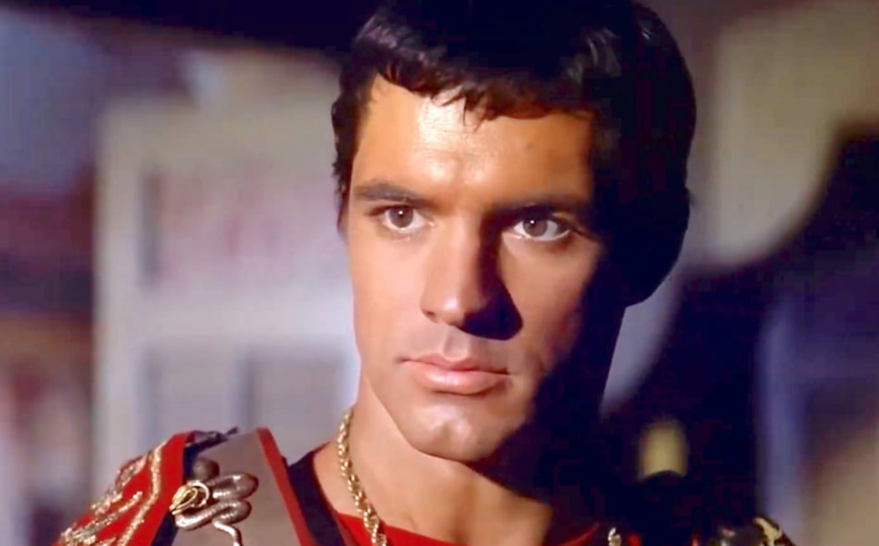 John Gavin as Julius Caesar in Spartacus (1960) before being cast as 007