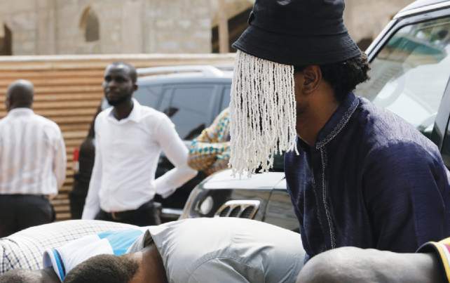 ANas Aremeyaw at a funeral for his friend and colleague at Tiger Eye