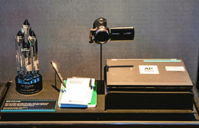 A SPYSCAPE display shows the Panasonic camera and journalism tools used by AP to track slave laborers