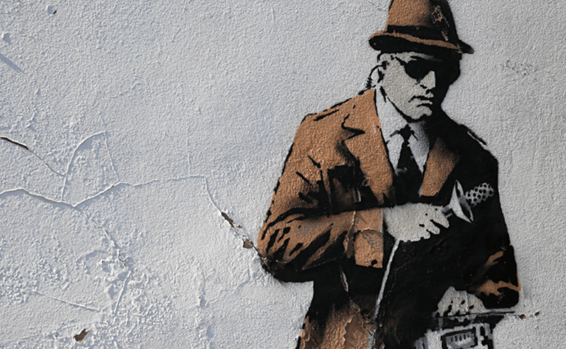 A painting of a spy on the wall of a building