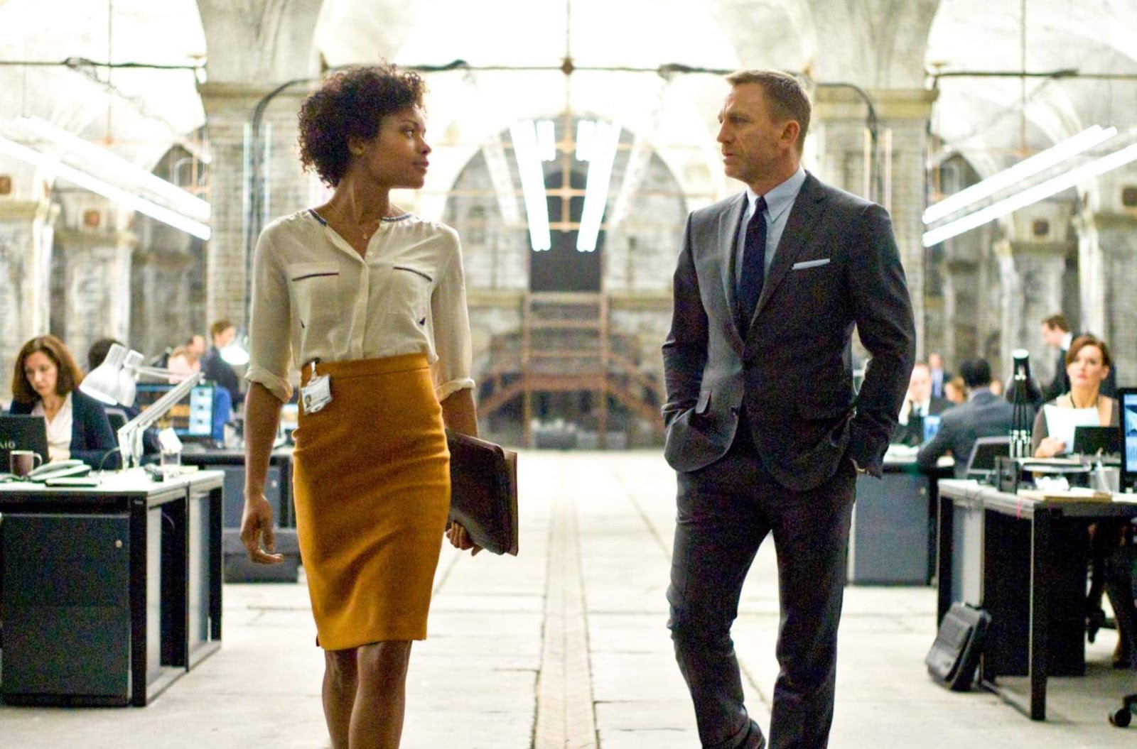 Naomie Melanie Harris and Daniel Craig as Moneypenny and 007