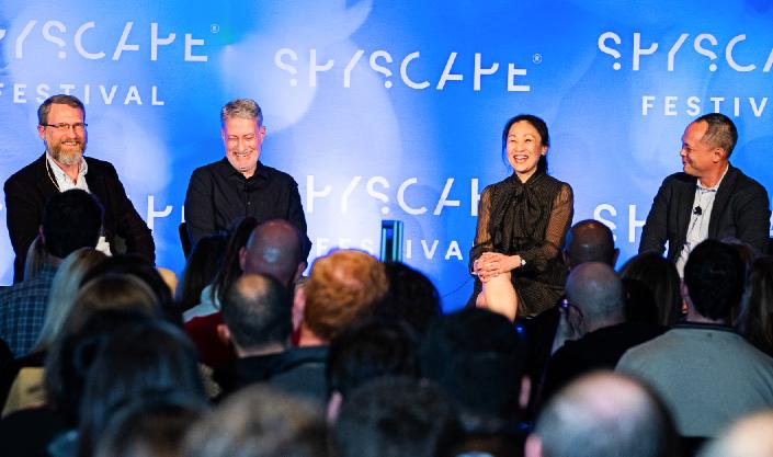 Sonya Lim onstage with Christopher Turner at the SPYSCAPE Festival 2022