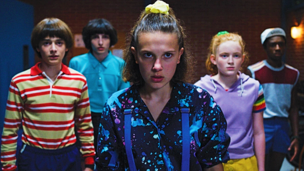 Millie Bobby Brown (front) as Eleven with the cast of Stranger Things