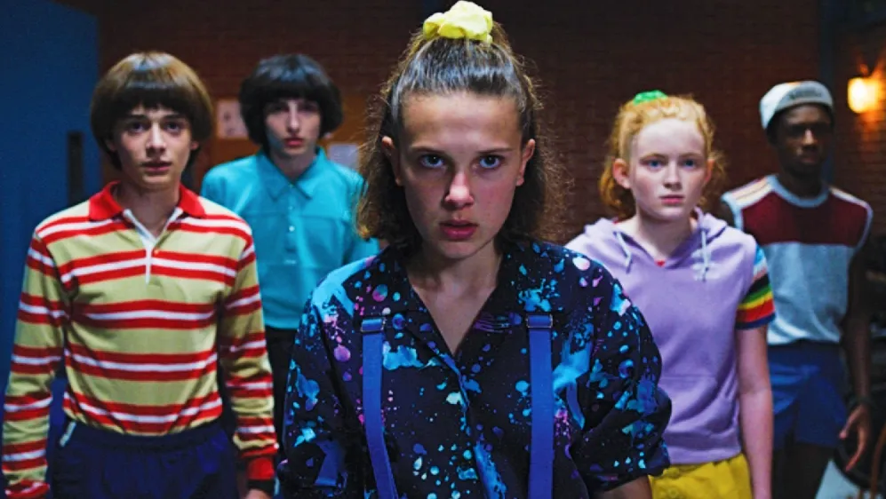 Millie Bobby Brown (front) as Eleven with the cast of Stranger Things