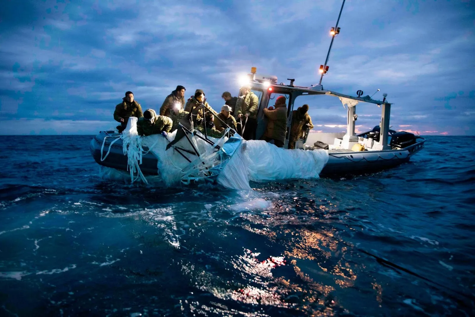 Divers from the Navy and FBI looking for spy balloon debris