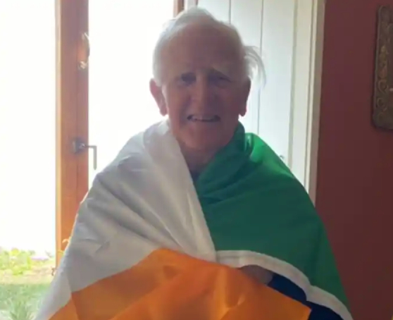 John le Carre in an Irish flag