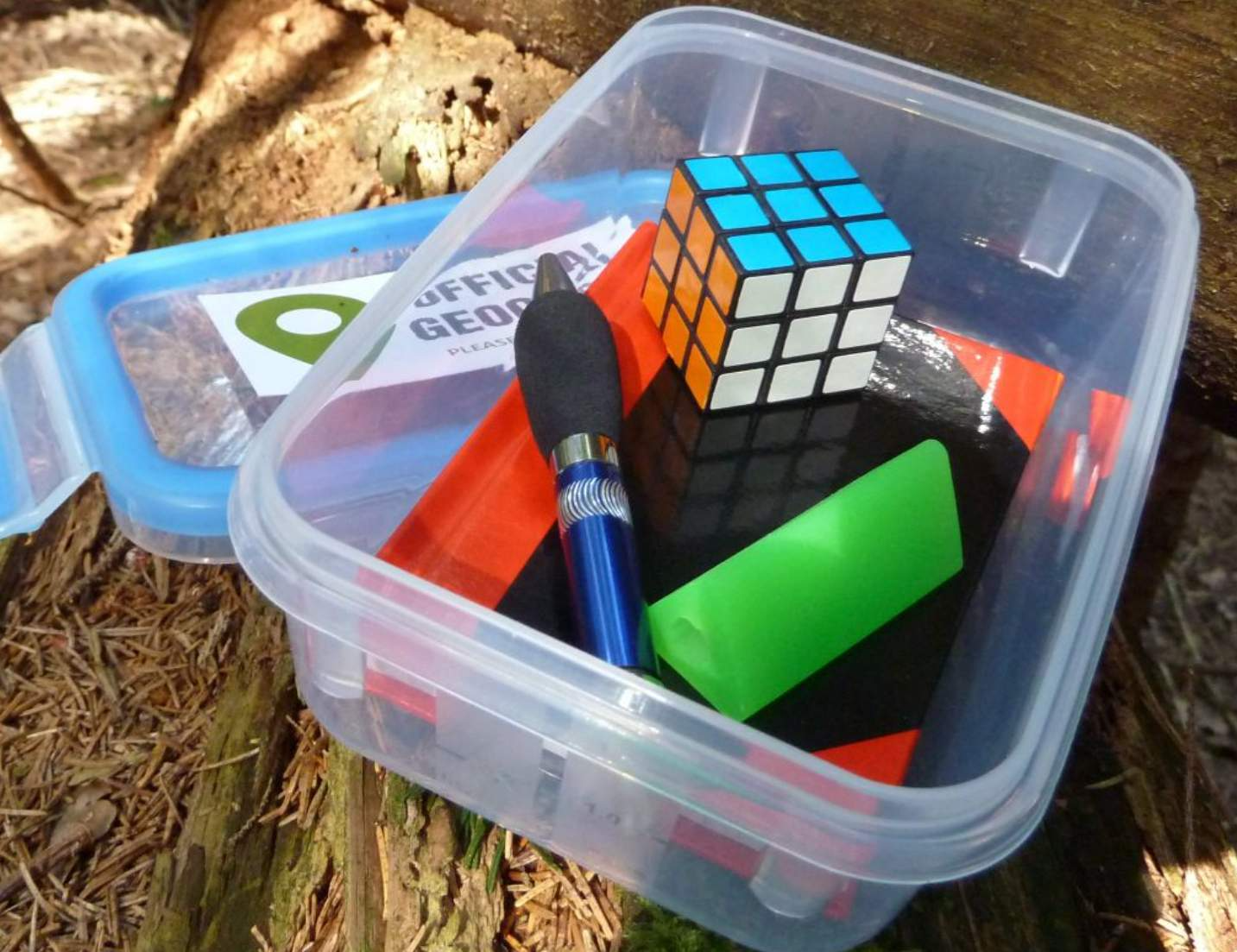 Geocache trinkets and Rubik's Cube