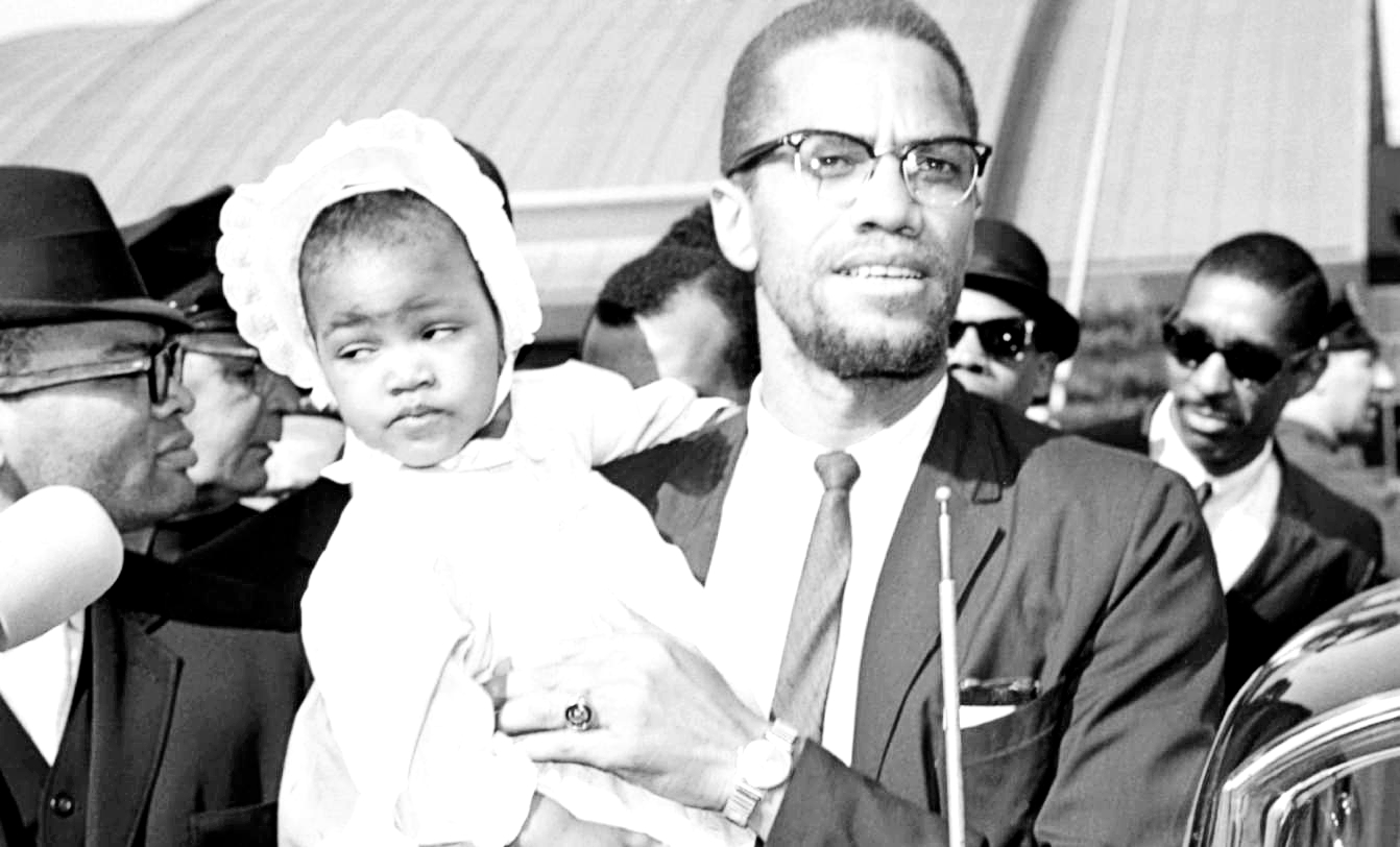 Malcolm X and his daughter, Ilyasah Shabazz at the age of two