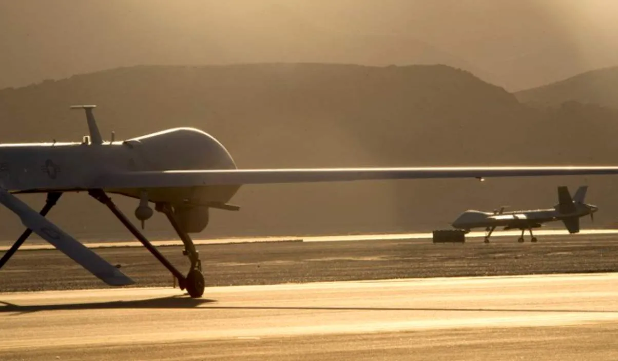 An MQ-1B Predator (left) & MQ-9 Reaper at Nevada’s Creech Air Force Base