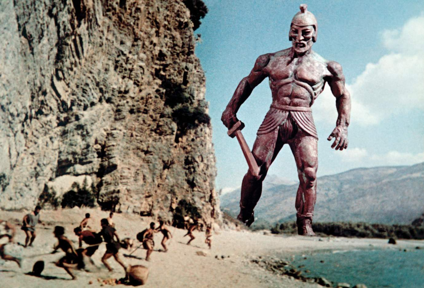 Talos looks down at beachgoers in the fantasy film Jason and the Argonauts (1963)