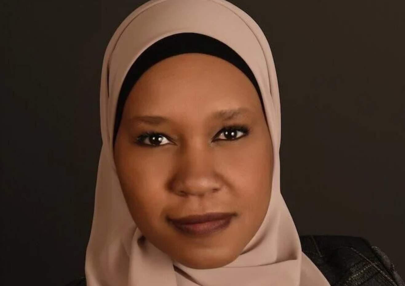 Huda Mukbil, a Black, Muslim female intelligence officer 